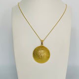 Gold circle pendant necklace